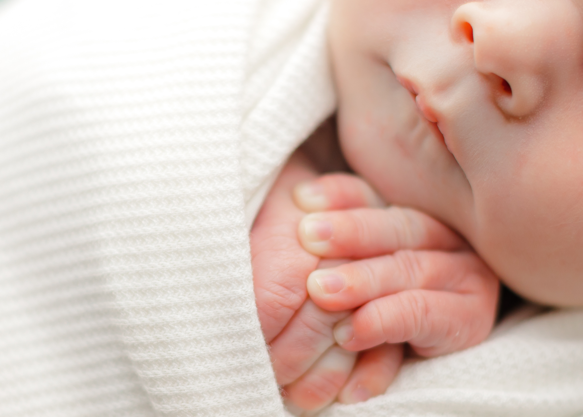 Details of a sleeping newborn baby hands and face precious glimpse ultrasound