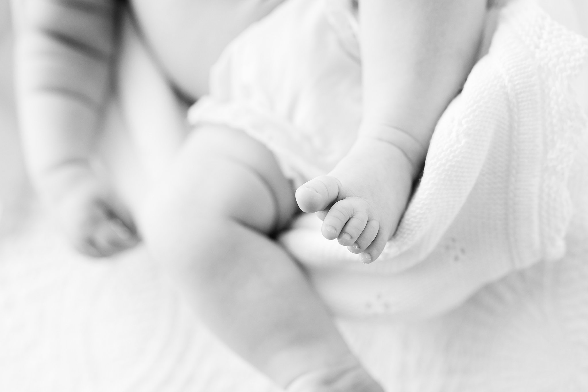 Details of a newborn baby's foot while in a diaper