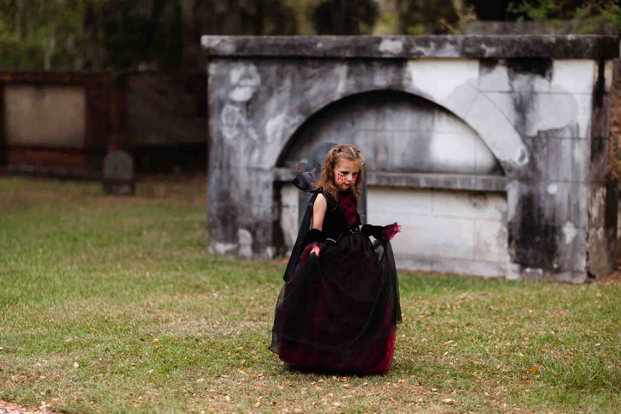 Little girl in a Halloween vampire costume in haunted Savannah, ga