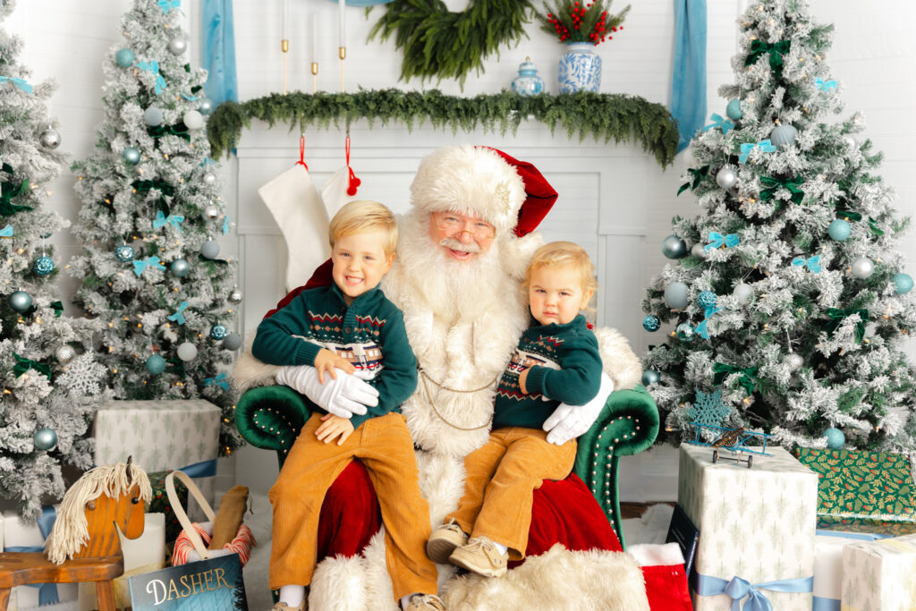 Two brothers smiling with Santa during a private Santa Experience in Savannah, GA.