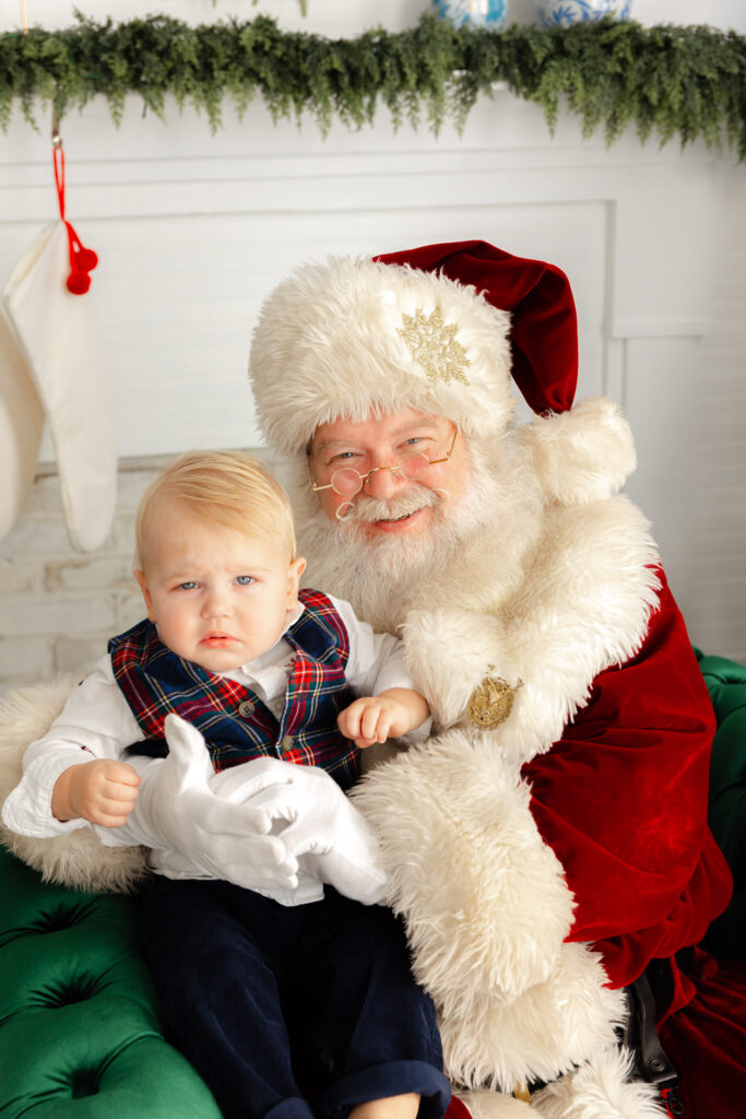 Close up portrait of a toddler and Santa during a Savannah Santa Experience.