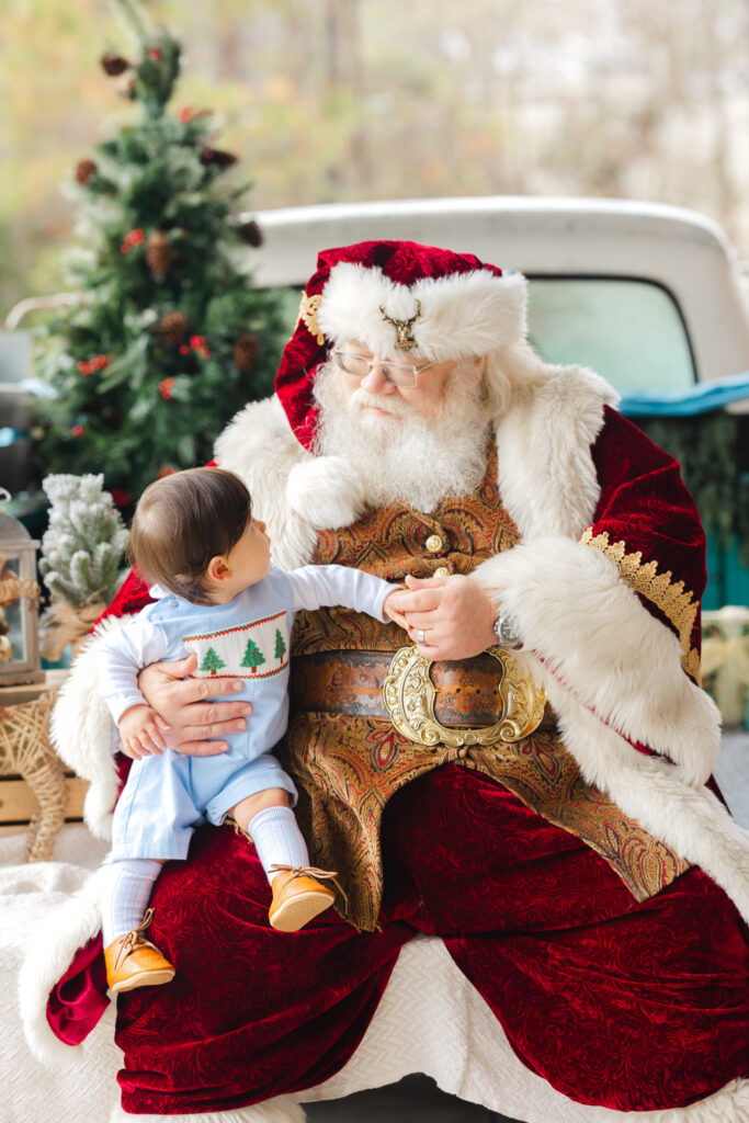 Santa interacting with a baby during a private Santa Experience in Savannah, GA.