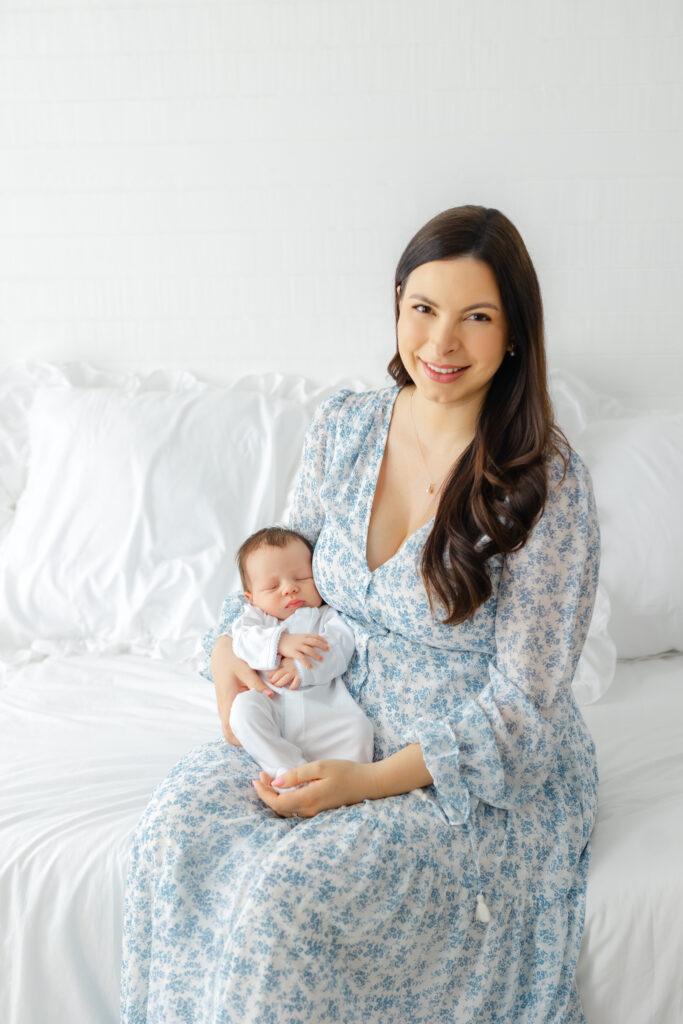 Newborn photography outfit inspiration featuring soft blue clothing for Mom and baby.